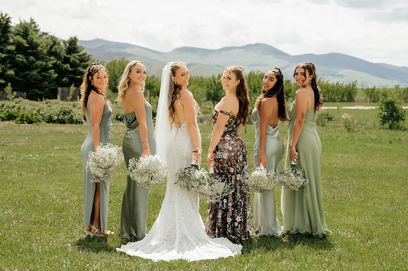 Bride with bridesmaids in green dresses