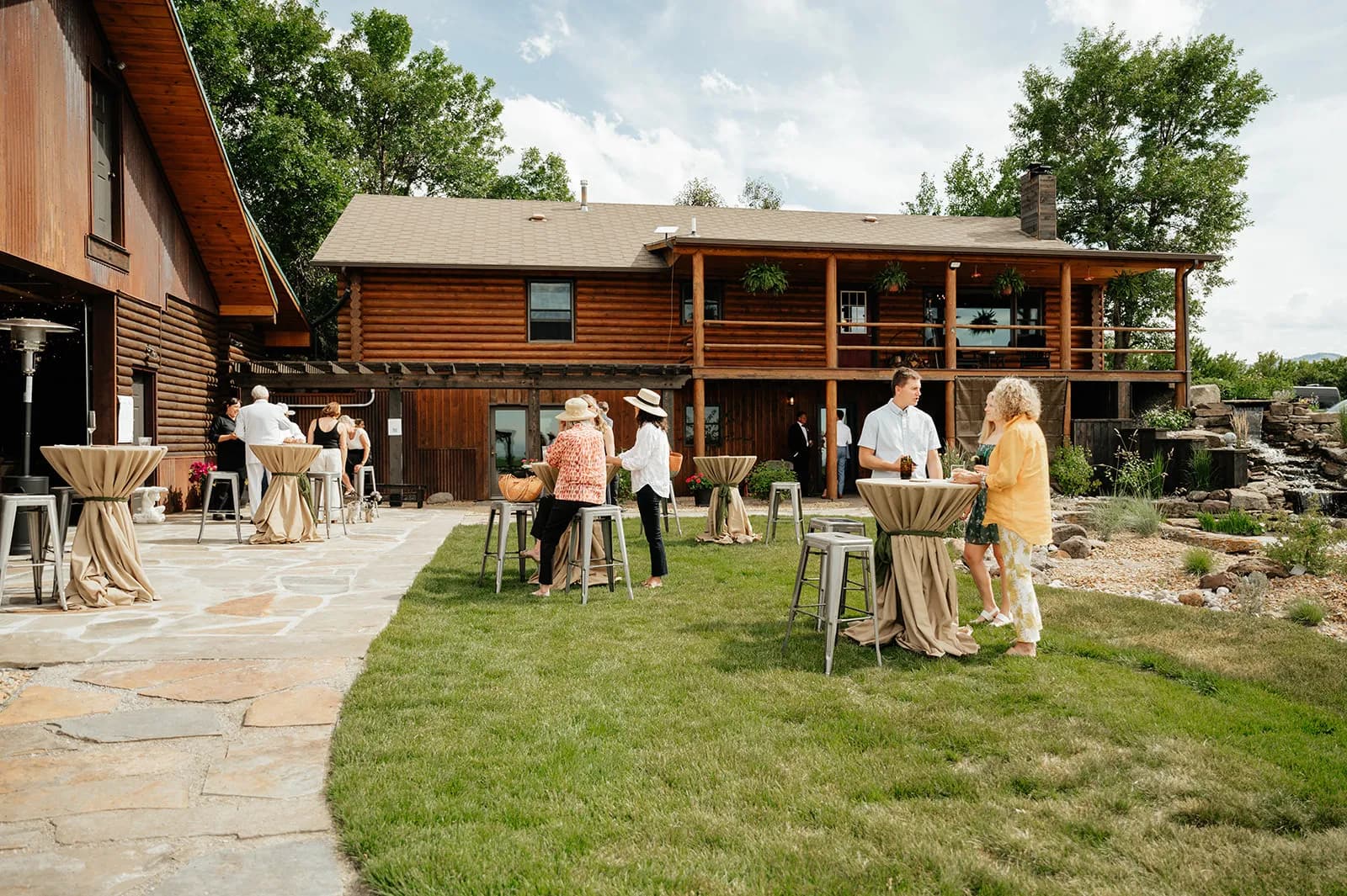 Guests networking on an outdoor patio at a Bozeman corporate event venue