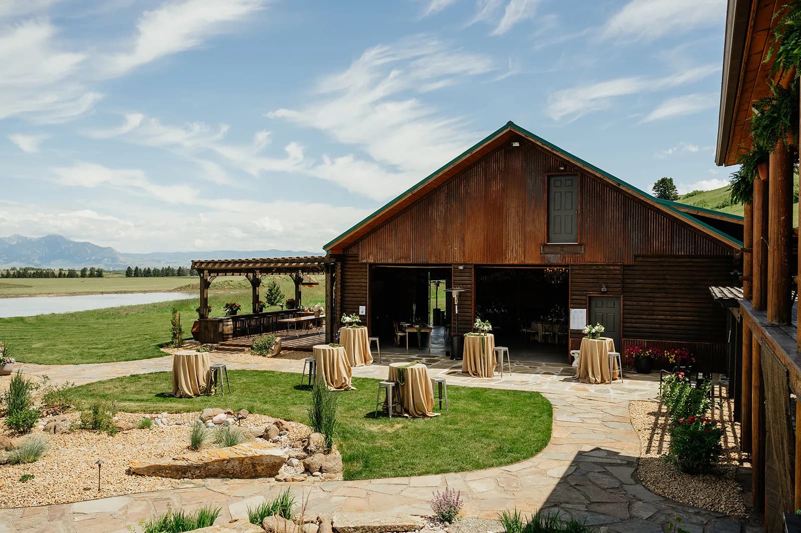 Event Lodge exterior with patio seating and scenic mountain views
