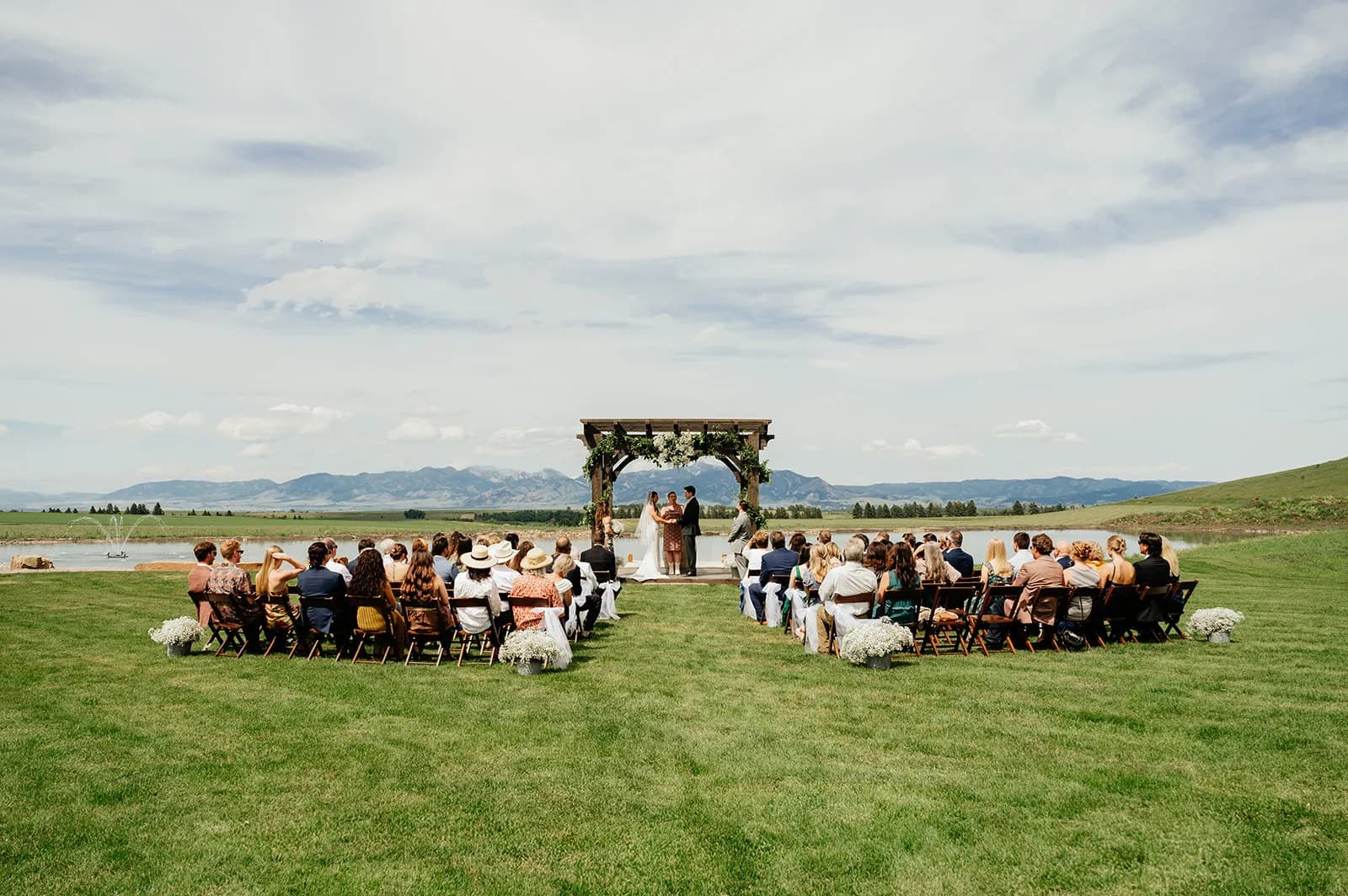Outdoor wedding ceremony at Big Vista Ranch, a private Bozeman wedding venue with mountain views